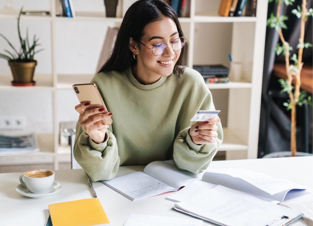 Student with card & phone Student with card & phone